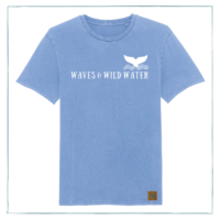 A blue t-shirt with Waves & Wild Water printed across the front in white ink. There is also a logo with a whale tail coming out of waves on the chest.