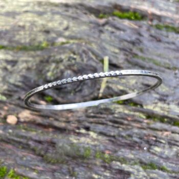 Sterling silver oval bangle with carved pattern