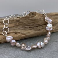 Silver chain and pink pearl bracelet