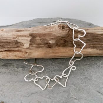 Row of hearts silver chain bracelet