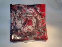 Black, red and white marble swirl glass plate