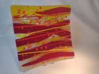 Red and yellow fused glass plate