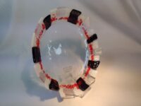 Black, white, and red glass bowl