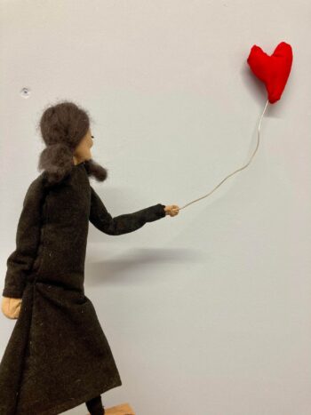 girl with heart shaped ballon