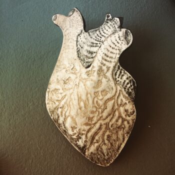 Anatomical heart with intertwined flora