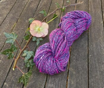 Handspun, plied bulky weight merino and silk yarn - pink and purple.